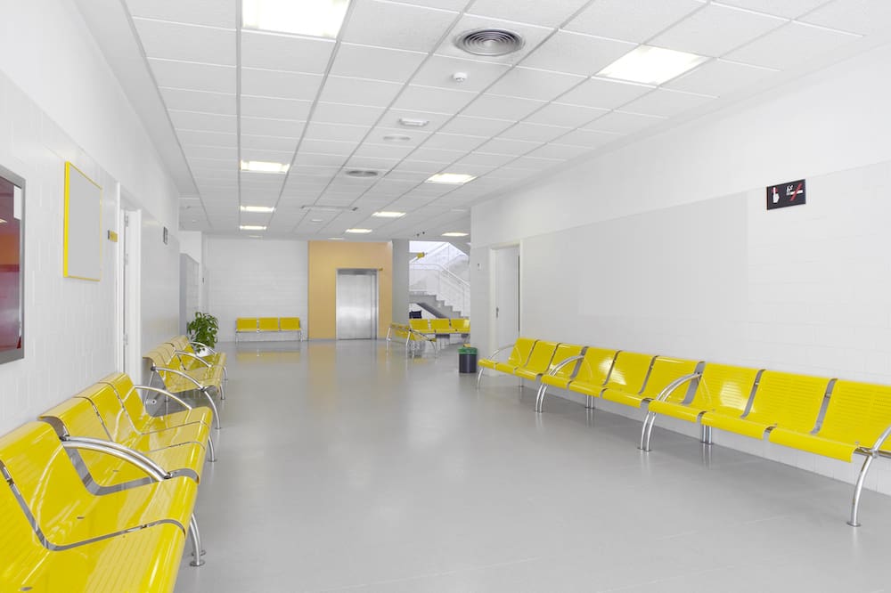 hospital building interior with yellow seats